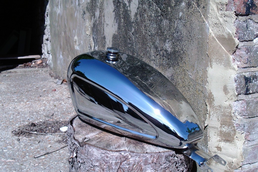 Actual photo beautifuly restored show chrome on a Noton motorcycle fuel tank.
