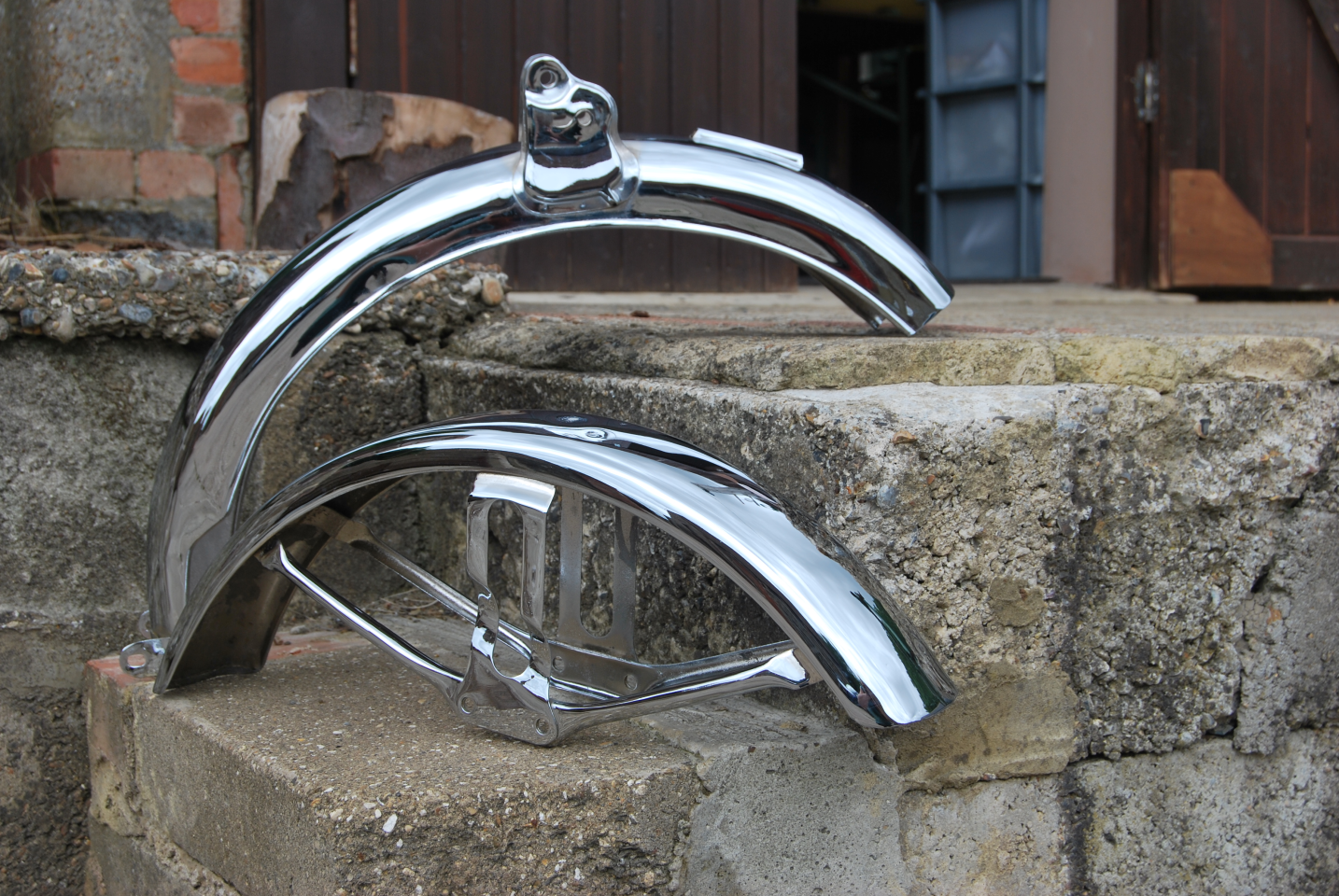 Picture of a motorcycle mudguards re chromed.