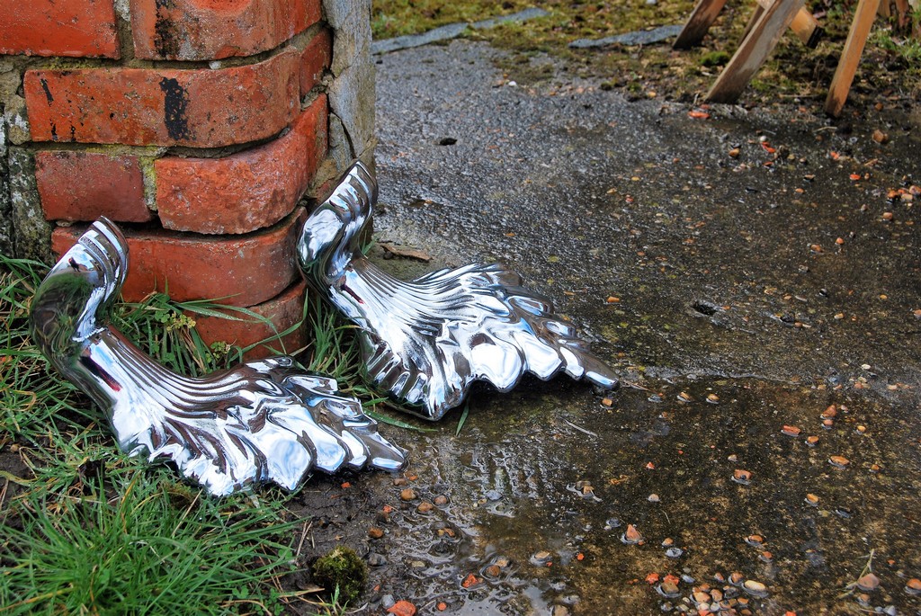 A set of vintage bath tub feet chrome plated by Ashford Chroming