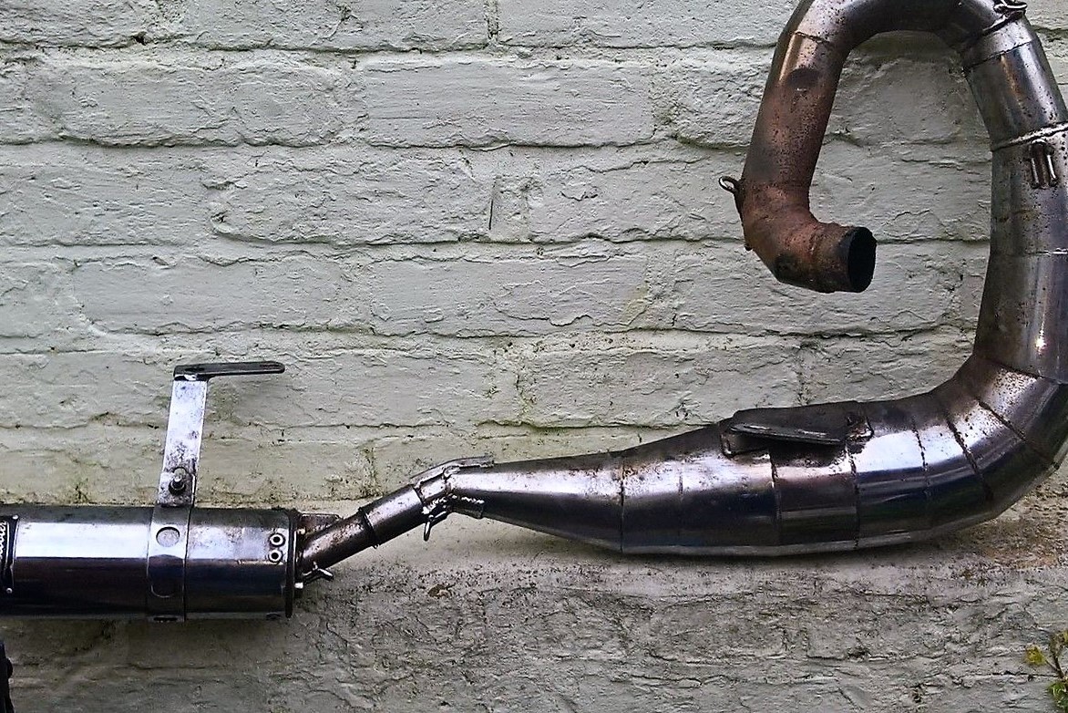 Scooter exhaust from a lambretta before it has been rechromed.