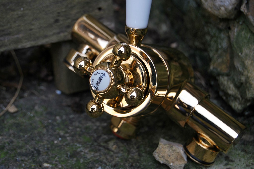 Picture of bathroom shower tap finished in gold plate